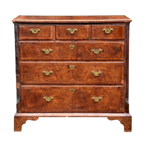 242 - A George I and later cross banded walnut six drawer chest the later quarter veneered burr walnut top... 