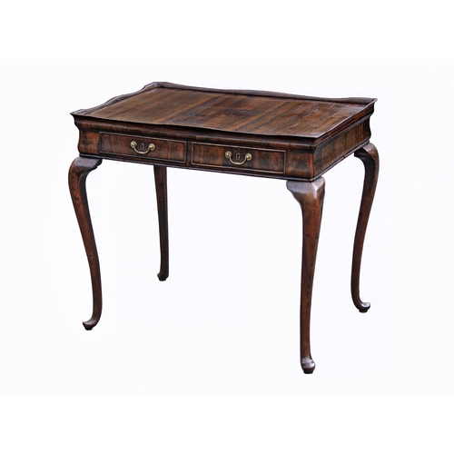 243 - An unusual George II silver table in an exotic veneer with dark striping, the tray top with serpenti... 