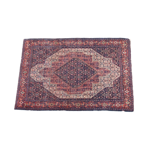 252 - An antique Senneh rug in reds, blues and ivory, with an all over floral design, 78¾ x 55in. (200 x 1... 