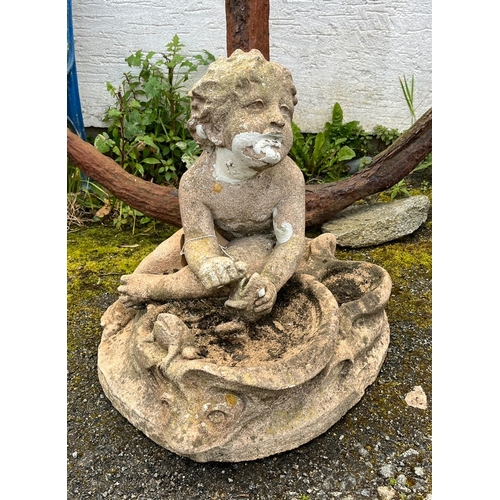 265 - A 20th century composite stone garden figure of a cherub playing with fish in a bowl with a frog sit... 