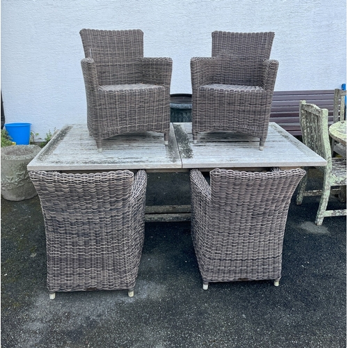 273 - A set of four woven faux-rattan garden or conservatory armchairs each standing 33in. (83.8cm.) high.... 