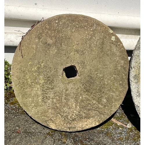 278 - A sandstone mill stone of typical circular form with central square hole, 24in. (61cm.) diameter and... 