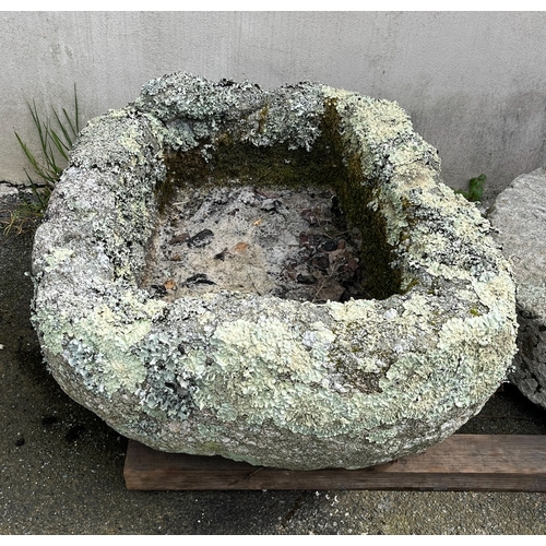 281 - A weathered rounded rectangular granite trough covered in lichen, 29 x 24½in. (73.7 x 62.3cm.), 14in... 