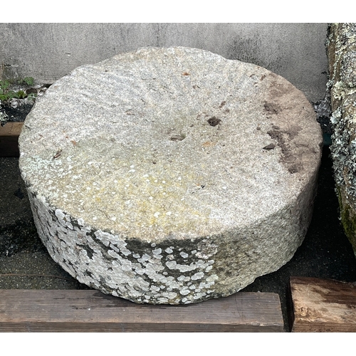 282 - A granite mill stone of typical circular form, central small hole, 21½in. (54.7cm.) diameter, 7in. (... 