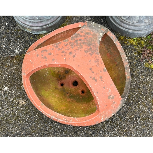 291 - A terracotta chicken feeder or planter of cylindrical form with raised section for making three comp... 