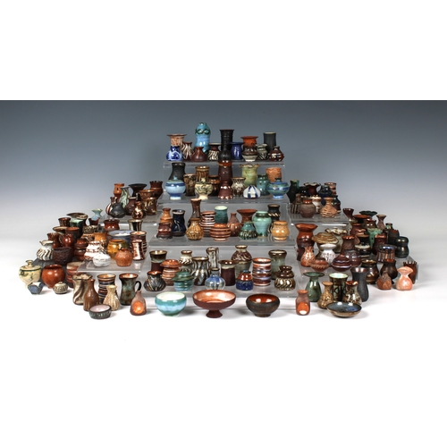 38 - Guernsey Studio pottery - Elizabeth Ann Macphail (1939-89) A large collection of miniature pots, vas... 