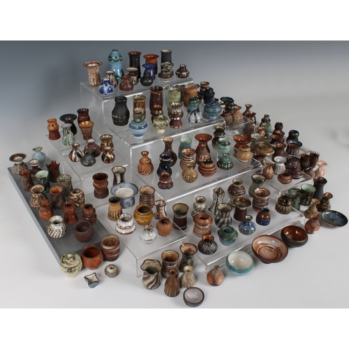 38 - Guernsey Studio pottery - Elizabeth Ann Macphail (1939-89) A large collection of miniature pots, vas... 