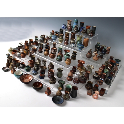 38 - Guernsey Studio pottery - Elizabeth Ann Macphail (1939-89) A large collection of miniature pots, vas... 