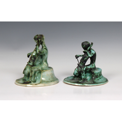 60 - Guernsey Studio pottery - Elizabeth Ann Macphail (1939-89) Two stylised green glazed cellist or doub... 