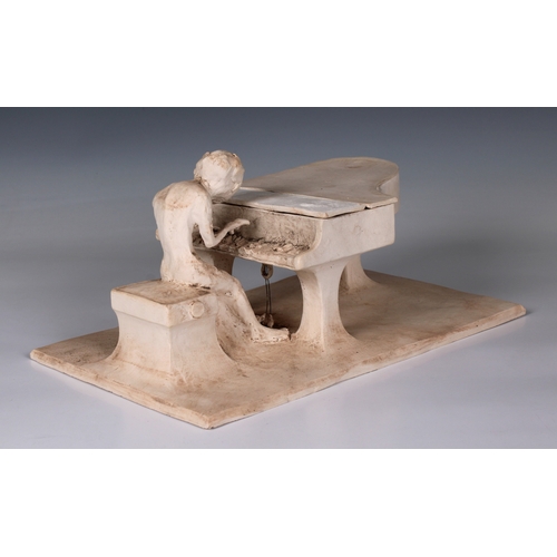 63 - Guernsey Studio pottery - Elizabeth Ann Macphail (1939-89) An unglazed figure playing a Grand Piano ... 