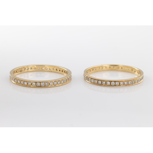 Two 18ct yellow gold and diamond eternity rings the pair of full ...