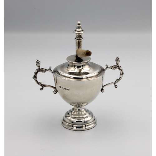 680 - A Victorian silver table lighter fashioned as a trophy cup / urn William Comyns & Sons, London, 1884... 