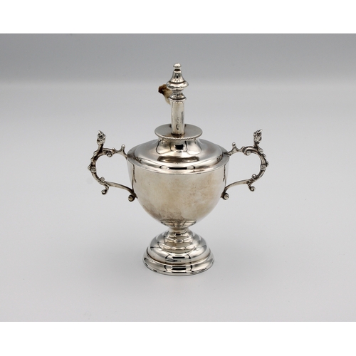 680 - A Victorian silver table lighter fashioned as a trophy cup / urn William Comyns & Sons, London, 1884... 