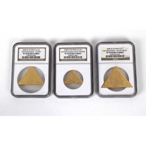 139 - A 2008 Tutankhamun three piece gold crown set - NGC graded housed in a gold effect pyramid box, each... 