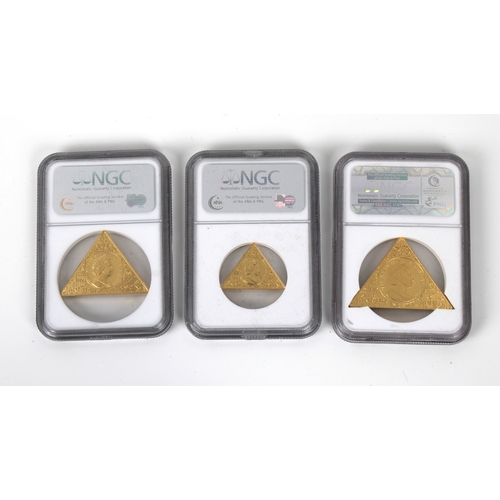 139 - A 2008 Tutankhamun three piece gold crown set - NGC graded housed in a gold effect pyramid box, each... 