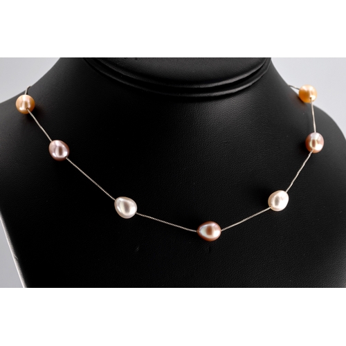 1053 - A freshwater pearl necklace the silver box-link necklace set with pairs of pink and white pearls, le... 