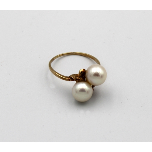 1054 - A modern cultured pearl cross over 14k yellow gold ring two Akoya pearls to engraved foliate setting... 