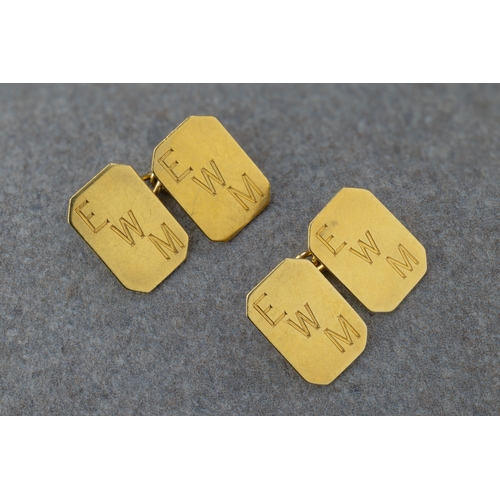 1070 - A pair of 18ct yellow gold cufflinks each elongated octagon plaque engraved with initials 'EWM', to ... 