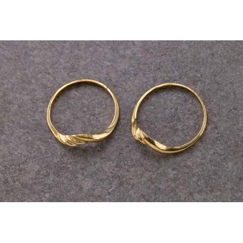 1071 - Two 9ct yellow gold rings of twist design, ring sizes M and O, (2).