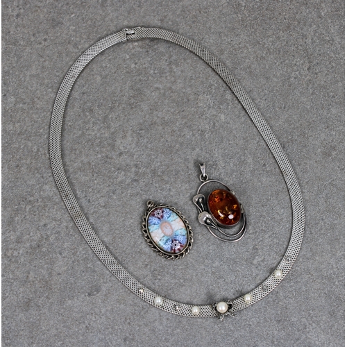 1083 - A silver flat woven necklace set with applied bow and pendant pearl flanked by alternate marcasite a... 