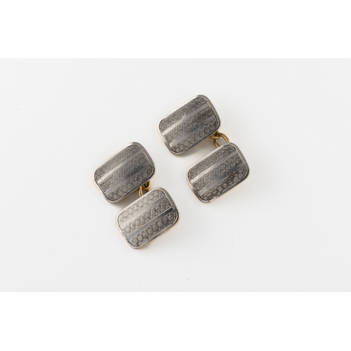 1086 - A pair of early 20th century 18ct yellow gold and platinum cufflinks the 1.5cm x 1cm rectangular eng... 