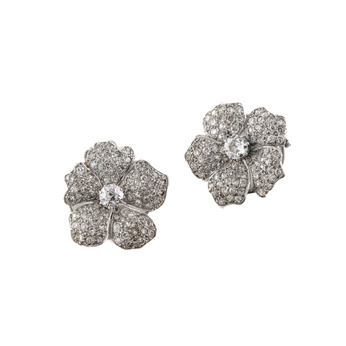 1089 - A pair of mid-20th century diamond flower ear clips, each with five petals pave-set with eight-cut d... 