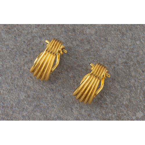 1104 - A pair of 9ct yellow gold clip earrings.