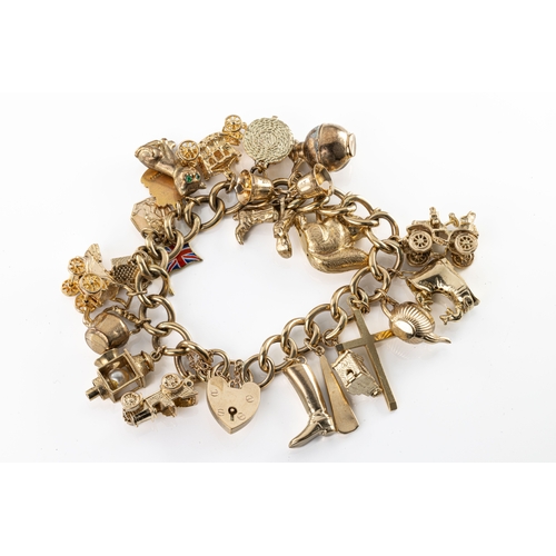 1130 - 9ct yellow gold charm bracelet A 9ct yellow gold curb link bracelet with multiple charms, including ... 