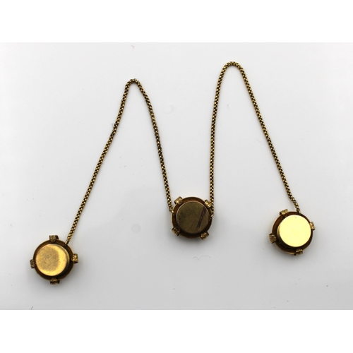 1182 - An unusual yellow metal mourning shirt collar chain with three attached collar studs having glazed p... 