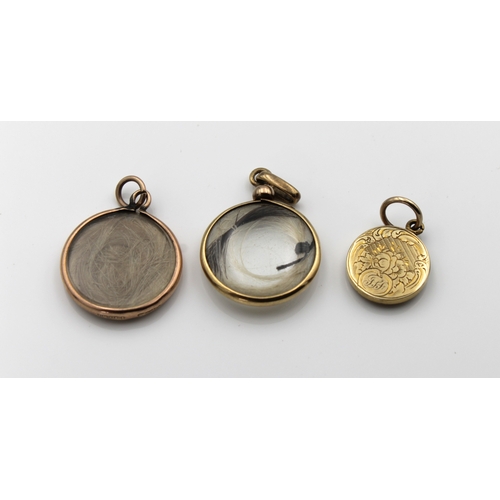 1189 - Three circular glazed mourning hair pendants in yellow & rose gold (not tested), the largest 22mm di... 