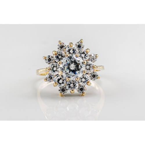 1203 - A cubic zirconia cluster ring in 9ct yellow gold, ring size J.