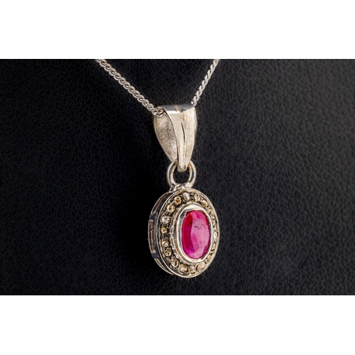 1291 - A matching set of rubies and diamonds the gold plated silver pendant set with an oval-cut ruby weigh... 