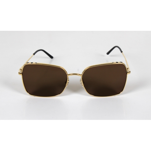 1305 - A boxed pair of Cartier gold plated Aviator sun glasses with booklet, leaflet, box, outer box and or... 