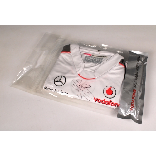 1307 - A Vodafone McLaren Mercedes F1 team X- Large size Hugo Boss male T-Shirt - Signed in black marker to... 