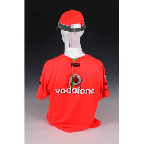 1311 - A Vodafone McLaren Mercedes official F1 team bright orange Hugo Boss large T-Shirt, signed below nec... 