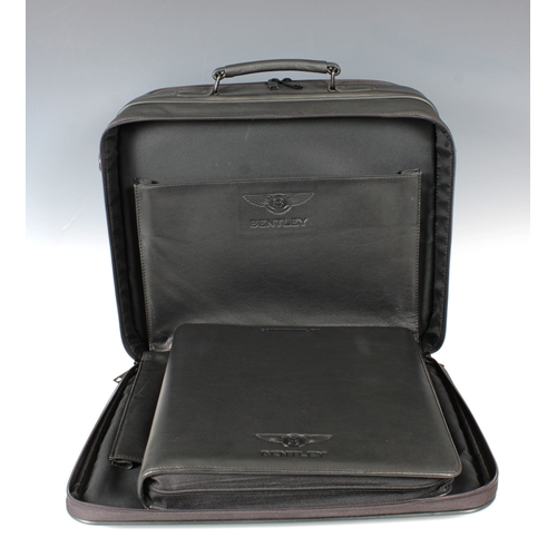 1344 - A Bentley Heritage black leather laptop brief case  featuring two zipped sections with various compa... 