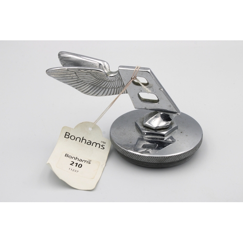 1351 - An original unused Bentley rearward leaning double winged 