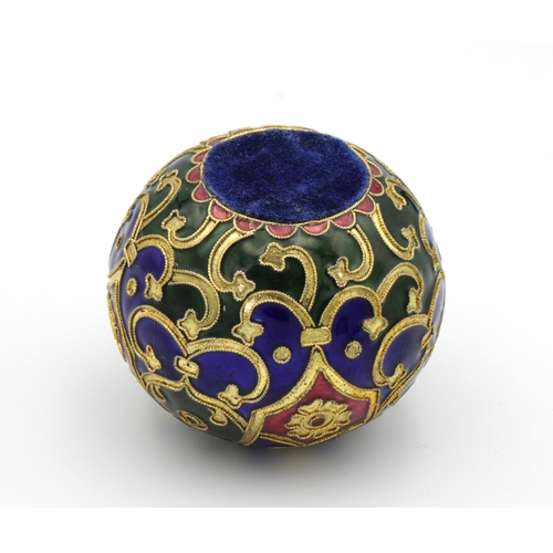 1366 - A vintage enamelled paperweight having criss-cross, foliate, floral and swag decoration, highlighted... 