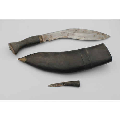 1370 - A Kukri knife of typical form with horn handle, curved 25« cm. blade, leather scabbard with one smal... 