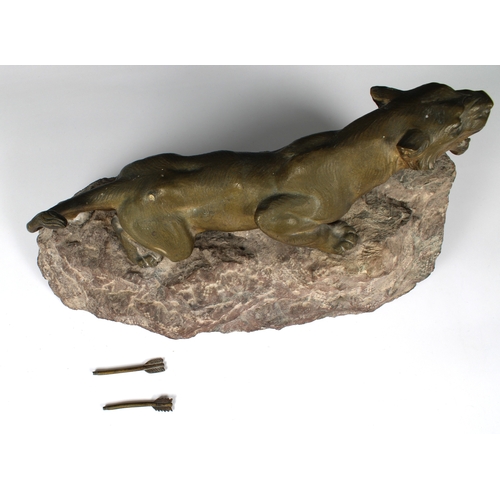 1399 - After Charles Valton (1851-1918) - Tiger bronze modelled crouching and pierced by arrows, raised on ... 