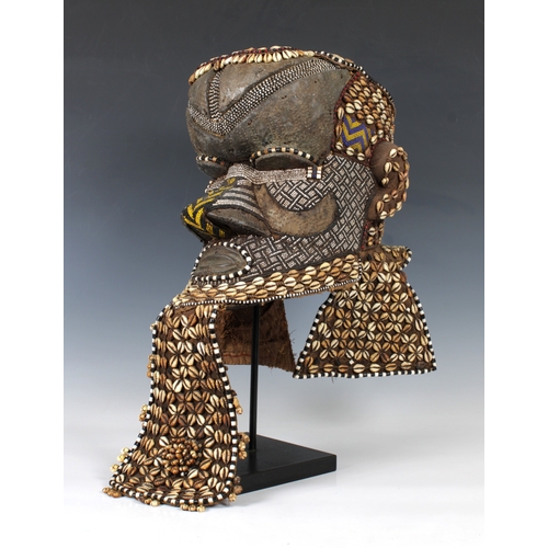 1403 - Ethnographica - A Kuba helmet mask or bwoom Democratic Republic of Congo, of typical form, decorated... 