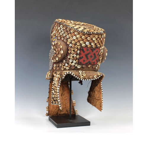 1403 - Ethnographica - A Kuba helmet mask or bwoom Democratic Republic of Congo, of typical form, decorated... 