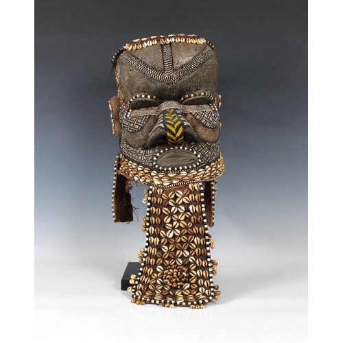 1403 - Ethnographica - A Kuba helmet mask or bwoom Democratic Republic of Congo, of typical form, decorated... 