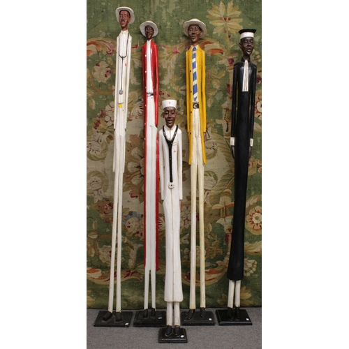 1404 - Ethnographica - A group of Colon statues Likely Ivory Coast, 20th Century, to include two Doctors, a... 