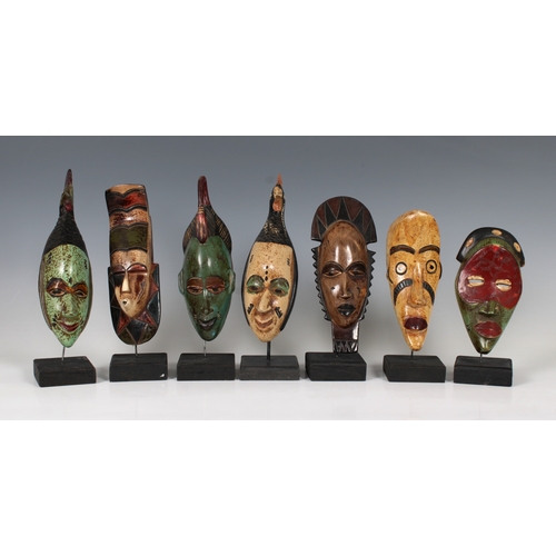 1409 - Ethnographica - A collection of African masks on stands Likely 20th Century, Congolese or Ivorian, t... 