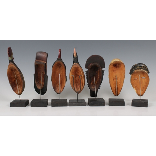 1409 - Ethnographica - A collection of African masks on stands Likely 20th Century, Congolese or Ivorian, t... 