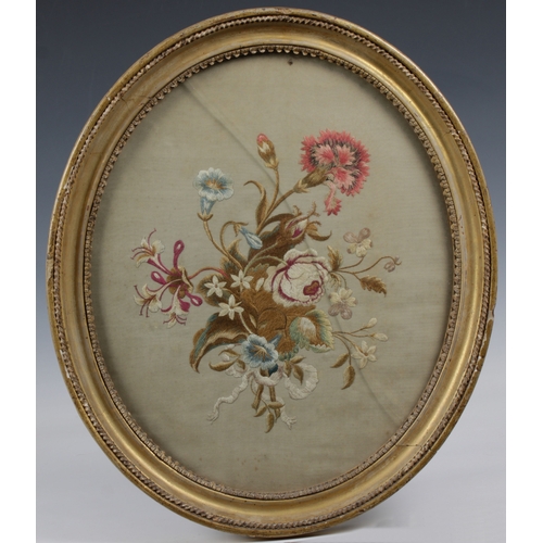 1451 - Three 19th century framed silk embroidery of flowers c.1830, to include a oval example with Verre g... 