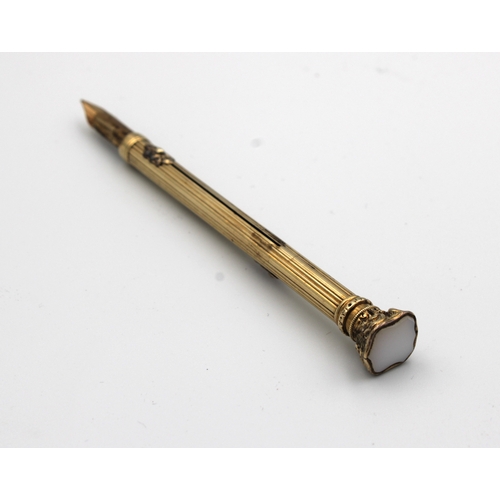 1454 - A Victorian yellow metal propelling pencil / pen combination of typical form with twin sliders and w... 