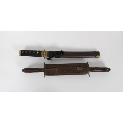 1458 - An Indian two piece carving set with carved wooden handles and case brass bound, together with a Jap... 