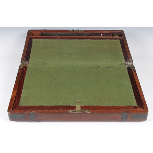 1463 - A Victorian mahogany writing box with twin brass handles and brass straps, opening to reveal a baize... 